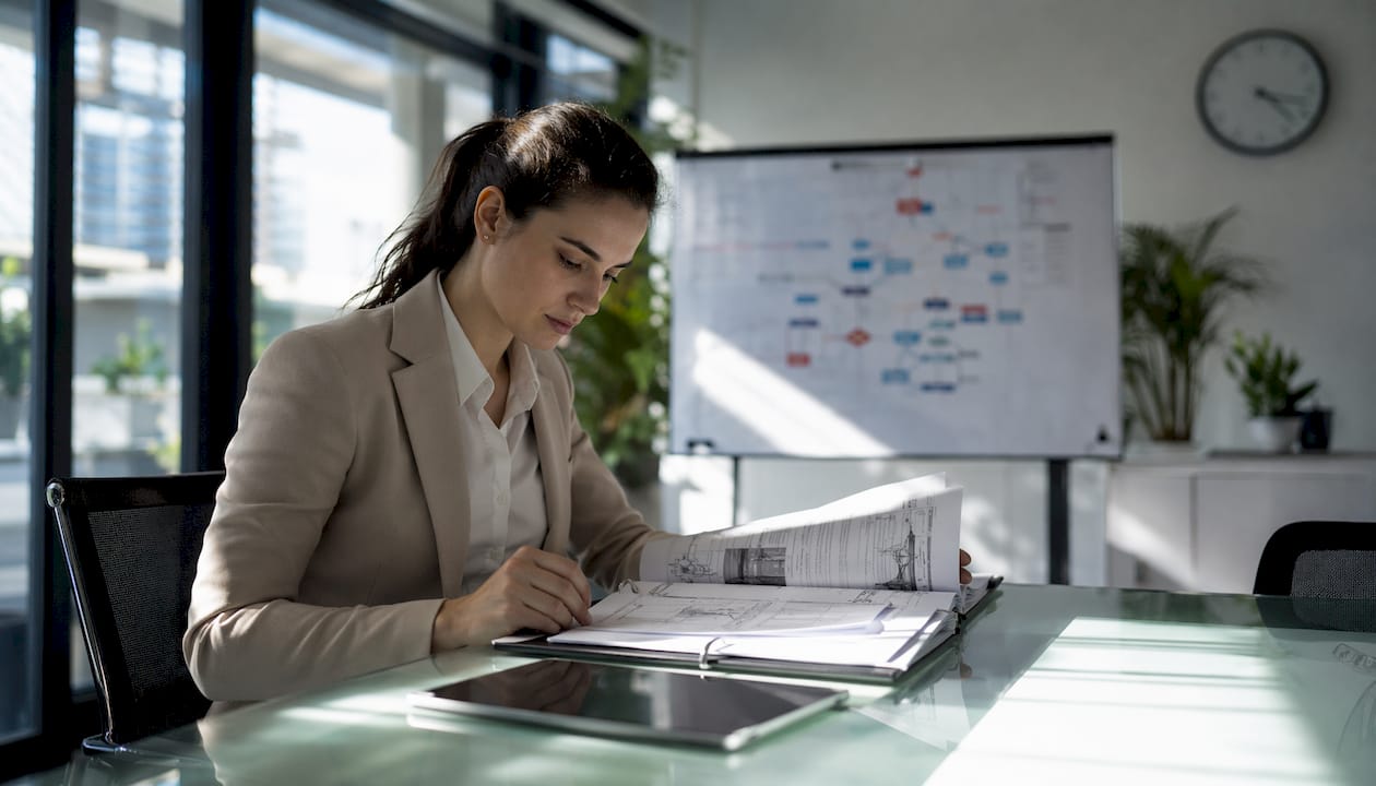 Logistics manager reading container standard manual