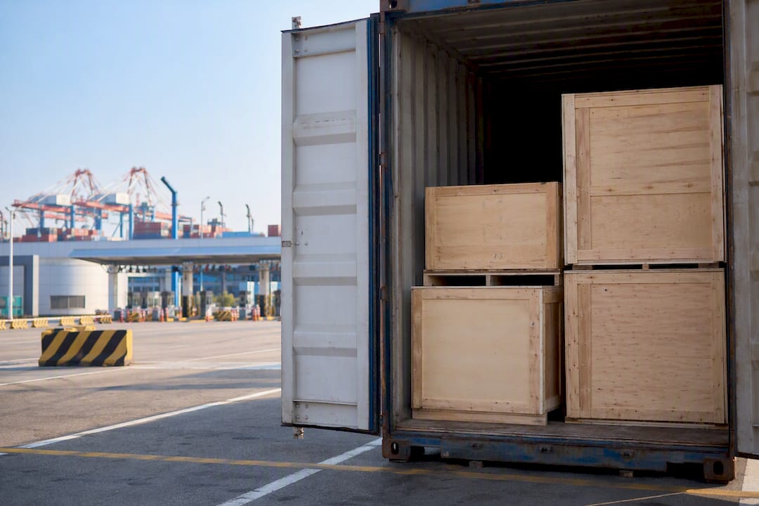 Cargo container with crates inspected at customs
