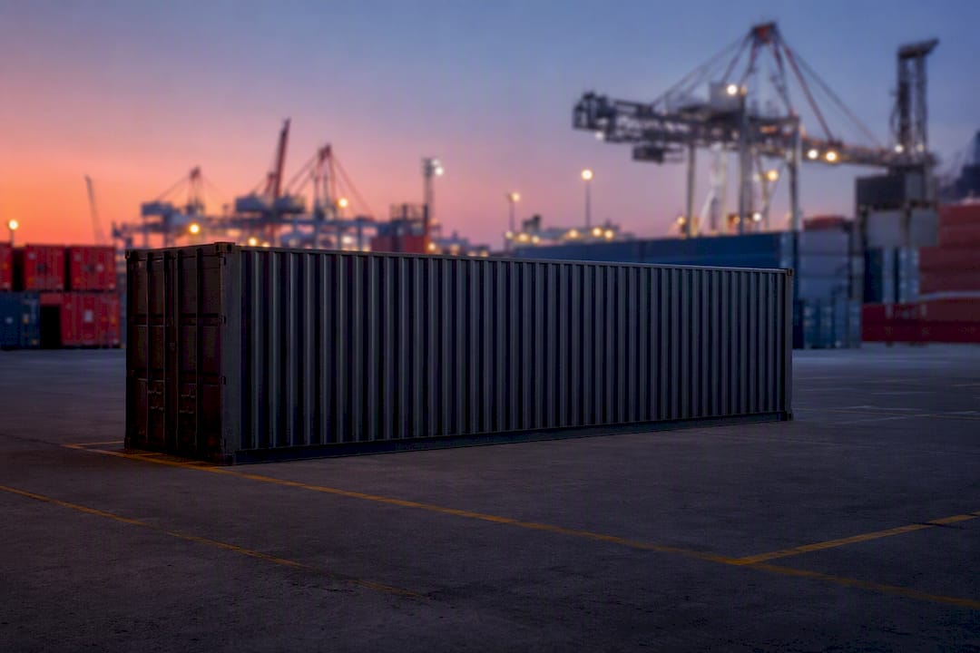 Silhouette of dry cargo container at shipping yard