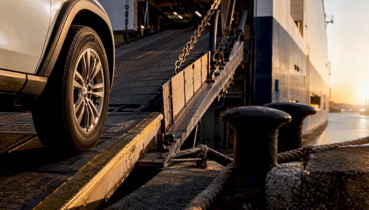 Partial vehicle tire entering RORO ship ramp