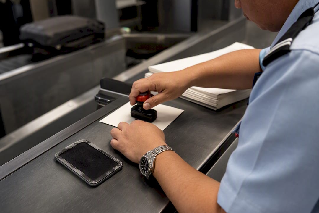 Hands stamping customs clearance certificate