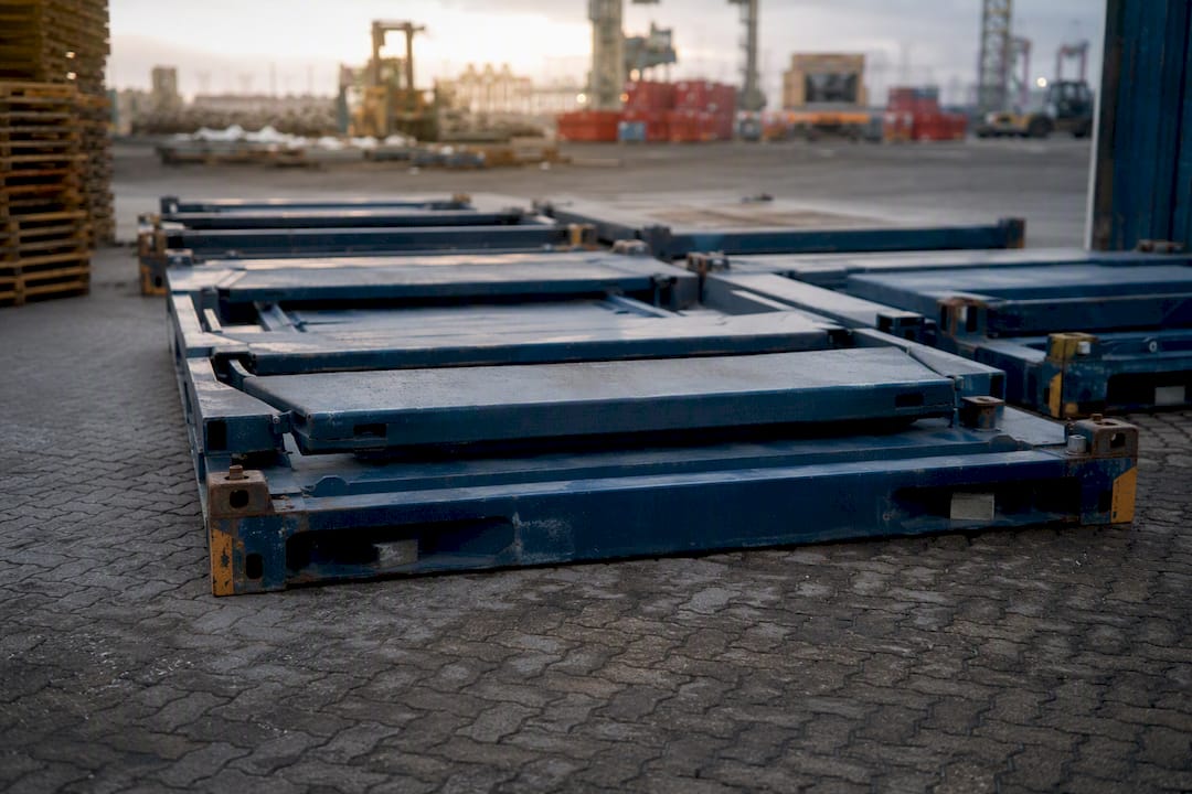 Stacked collapsible flat rack containers