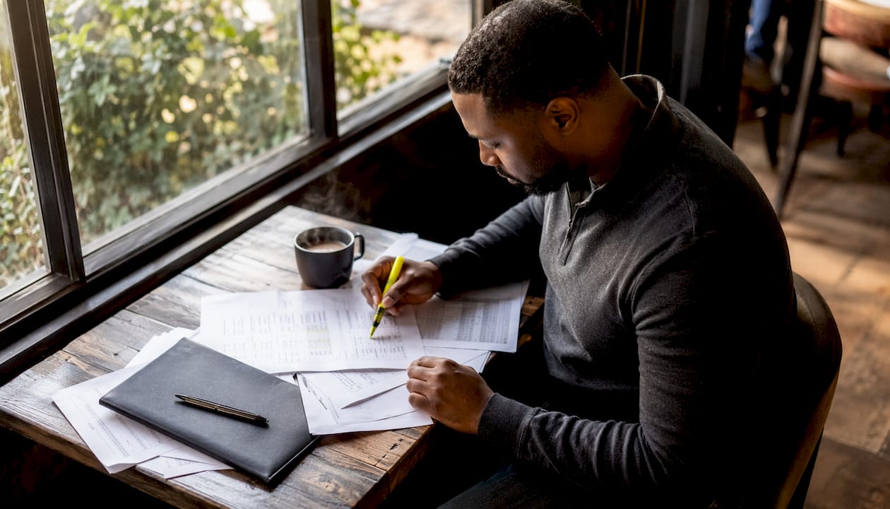 Logistics manager reviewing compliance documents