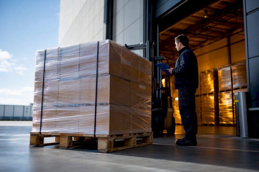 International freight pallet moving through cargo facility